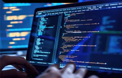 Close-up of hands typing code on a laptop, with colorful programming text on screen and Diploma in Software development title above.